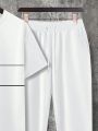A new white casual men's set for summer 2025 featuring a cool and breathable street T-shirt and long pants.