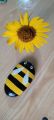 stone painting of honey bee. 