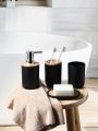 4-piece black bathroom accessories set, plastic toothbrush holder with bamboo cover, toothbrush cup, lotion dispenser, soap box. 