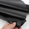 Black top layer fine grain cowhide leather material, real leather lychee pattern soft cowhide sofa, car seat headboard soft bag.