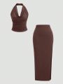 New Fashionable and Elegant Hanging Neck Top+Split Simple Solid Half Skirt Set. 