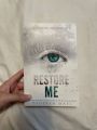 restore me book ( from the shatter me series). 