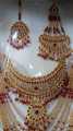 Latest design New bridal Jewelry set with matha pati in red colour. 