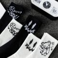 Random multiple pairs of men's crew socks graffiti ghost face unique street trend moisture wicking. 
