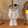 A Creative Face Storage Box – a Desktop Organizer with a Brush Holder for Storing Makeup Brushes Amagi. 