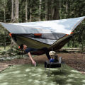 TRAVELER Bushcraft Quick-Deploy Hammock with Mosquito Net, Integrated Ridgeline & Anti-Roll Design for Wilderness Camping.