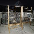 Metal Bunk Bed Frame over Two Single Wrought Iron Beds. 