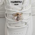 A Pair of Detachable Cute Little Bee-Style White-Winged Shoes with Glittery Decorations on the Laces and the Buckle.. 