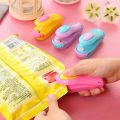 "Mini Plastic Bag Sealing Machine: Portable Sealer for Plastic Bags - Box Packed - Handheld Heat Sealer - Food Saver - Kitchen Sealing Tool - Compact Design - Easy to Use - Plastic Material - Storage Bag Sealer - Heat Sealing Machine - Vacuum Sealer - Bag. 