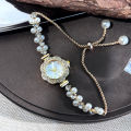 Double-Row Pearl Pull-Open Bracelet Diamond-Encrusted Case Arabic Numeral Scale Ladies Quartz Watch. 