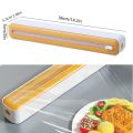 2-in-1 Plastic Wrap & Foil Dispenser with Slide Cutter - Durable Kitchen Organizer with Suction Cup Base for Home Use. 