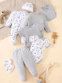 his 8-piece unisex newborn layette set fits boys and girls aged 0-9 months, with lovely grey bear prints..