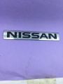 Nissan monogram logo, emblem, trademark, sign, mark, symbol, stamp, monogram, motif, badge, design, shield or figure. 