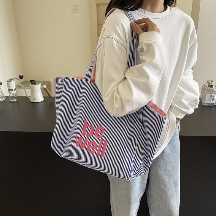 Large%20Capacity%20Tote%20Double-sided%20New%20Striped%20Casual%20Single%20Shoulder%20Textured%20Embroidered%20Canvas%20Bag%20for%20Students%20-%20Image%204