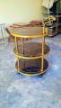 Tea Trolley circular shape golden color three shelf. 