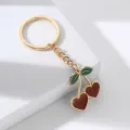 Cute Red Enamel Cherry Pendant Keychain for Women Girls Lovely Gold Color Fruit Keyring Keys Holder for Backpack Bag Gifts. 