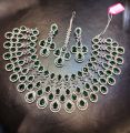 Green color indian diamond cut AD stone jewelry necklace set silver body party wear for women.