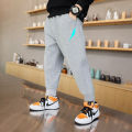 Boys Jogger Sports Pants Luminous Lightning Print Kids Cotton Long Sweatpant Cartoon Running Trousers with Pocket. 