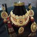 Latest design New bridal Jewelry set with matha pati in red colour. 