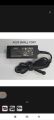 ASUS laptop AC adapter, commonly known as a charger. . 