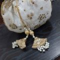 latest potli pouch purse clutch bag with round metal handle. 