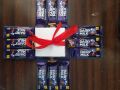 chocolate gift box 2 layers with 8 Giggle opus chocolate and 12 Cadbury dairy milk chocolates and ribbon. 