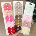 10Pcs/Set Solid Color Kids Bows Hair Clips for Baby Girls Handmade Ribbon Bowknot Hairpin Barrettes New Year Hair Accessories. 