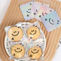 100pcs Cute Smiling Face Cookie Packaging Bag Laser Transparent Biscuit Bag Self-adhesive Bag Birthday Party Wedding Decoration.