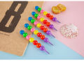 7 Color Crayons Cartoon Smiley Face. 