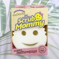 Free dual-sided scrubber + sponge (Scrub Daddy®) White smile face sponge. 