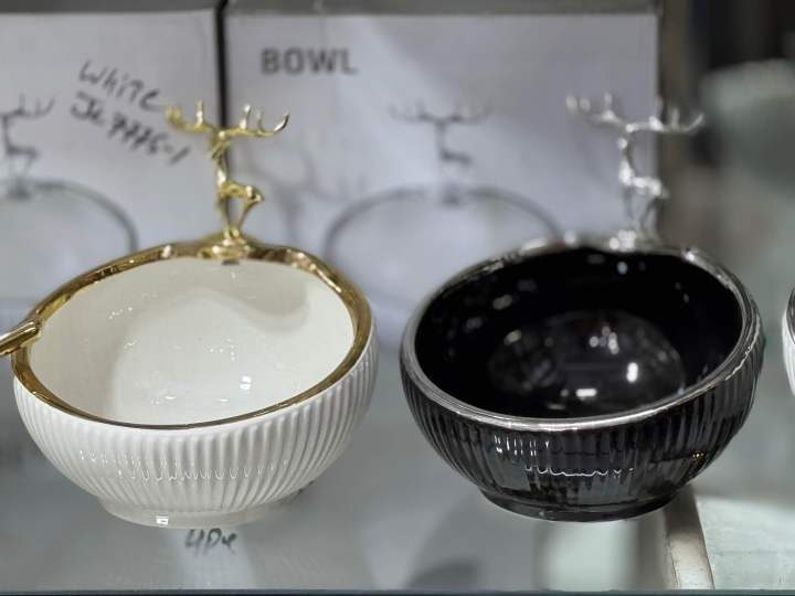 Small ceramic serving bowl with deer ornament