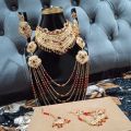 Bridal Jewellery set in Red and Golden colour with beautiful Crystal mala, bindeya and jhumer. 