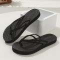 Ladies student fashion trend features pure black double strap anti-slip wear-resistant soft sole flip-flops. 