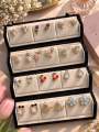 Any 12 pair korean Earings with Jhumka box jewelry box. 
