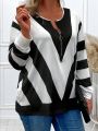 Plus Size Women's V-Neck Geometric Striped Long Sleeve Top with Zipper Detail for Chic and Modern Style. 