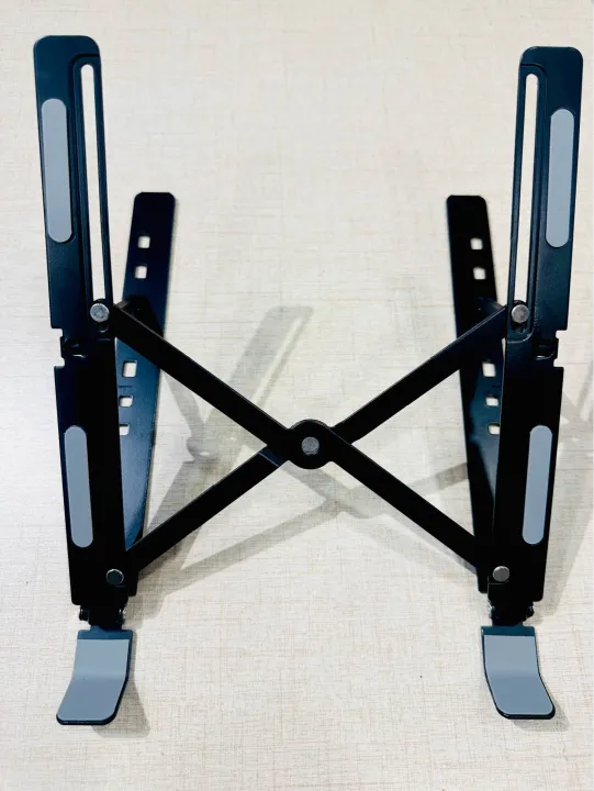 Portable%20Aluminum%20Foldable%20Laptop%20Metal%20Stand%20Adjustable%20Height%20Folding%20Laptop%20Holder%20Solid%20Stand%20With%20Anti%20Slip%20Rubber%20Grips%20-%20Silver%20-%20Image%209