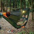 TRAVELER Bushcraft Quick-Deploy Hammock with Mosquito Net, Integrated Ridgeline & Anti-Roll Design for Wilderness Camping.