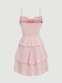 Fashionable women's waist cinched three-layer ruffle edge bow suspender dress. 