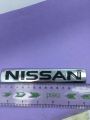Nissan monogram logo, emblem, trademark, sign, mark, symbol, stamp, monogram, motif, badge, design, shield or figure. 
