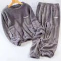 Leisure 2024 Autumn/Winter Women's Warm Velvet Pajamas Loose Round Neck Elastic Top Warm Wool Elastic Waist Tight Leg Pants Set.