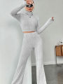 Stand Collar Navel T-shirt and Trumpet pants.