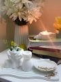 Set of 4 pc home decor set, one arch wavy tray, one shell tray, one candle holder, one lady head vase for flowers. 