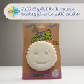 Free dual-sided scrubber + sponge (Scrub Daddy®) White smile face sponge. 
