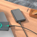 Hoco J100 High-Ranking 10000mAh Power Bank – Dual USB Output, Type-C & Micro-USB Input – Black.
