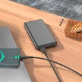 Hoco J100 High-Ranking 10000mAh Power Bank – Dual USB Output, Type-C & Micro-USB Input – Black.