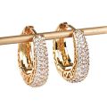 Huitan Hollow Gold Color Hoop Earrings for Women Paved Dazzling CZ Stone Luxury Trendy Female Circle Earrings Statement Jewelry.