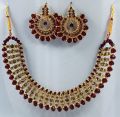 Maroon colour jewellery set of round crystal earrings and chowker neckless in maroon colour for girls and women for wedding party and eid in low price. 