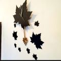 Black Maple Leaf Clock with Pendulum. 
