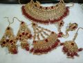 bridal first day jewellery heavy set in golden and red colour unique and stylish design. 