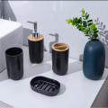 4-piece black bathroom accessories set, plastic toothbrush holder with bamboo cover, toothbrush cup, lotion dispenser, soap box. 